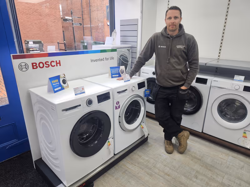 Nick repairing a washing machine